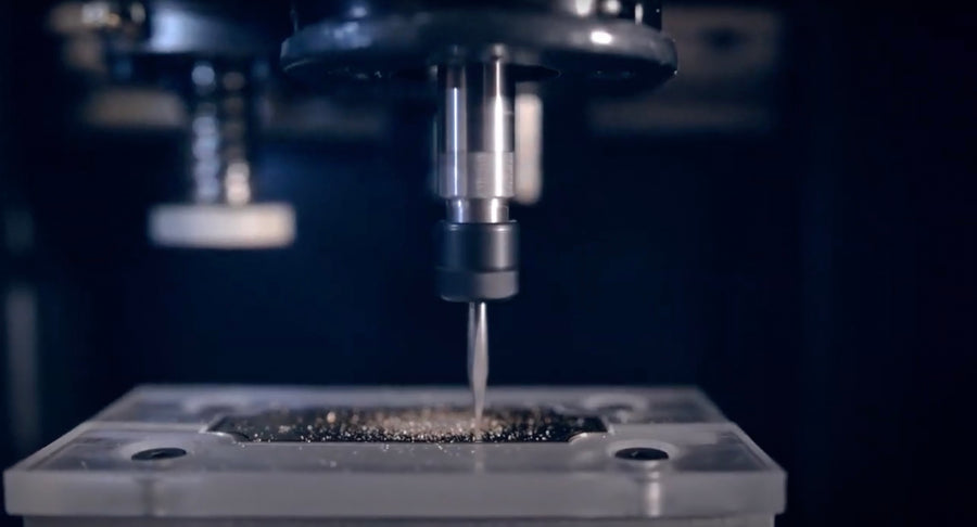 A brass plate being engraved